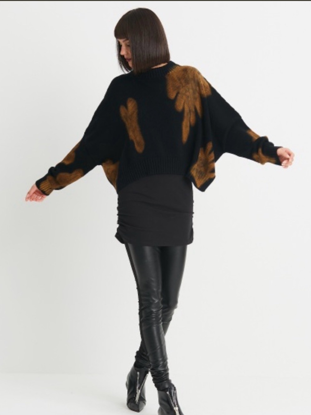 PLANET Black Sweater with Yellow Starburst Pattern